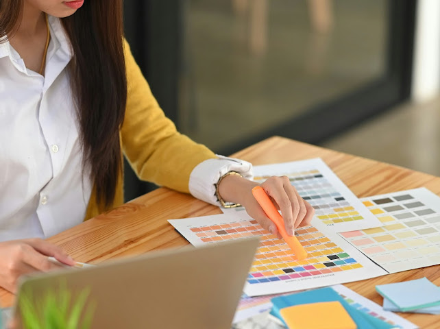 Woman reviewing colour sheets representing Candidate Intelligence