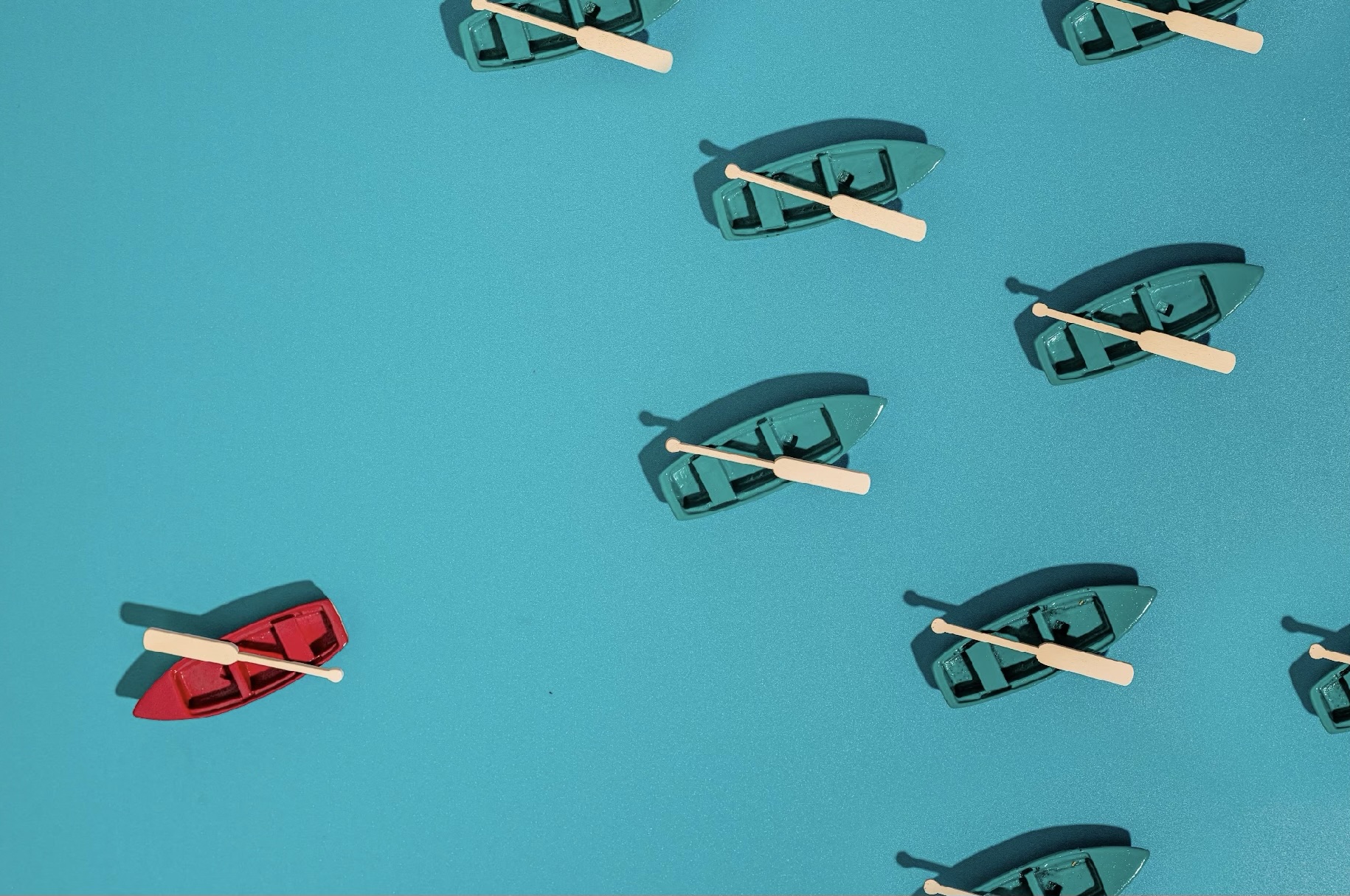 Boats on blue water representing Community and Knowledge